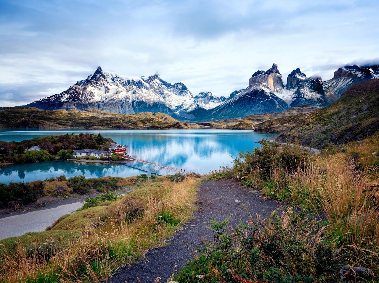 A stunning view of snow-capped mountains and crystal-clear lakes in Torres del Paine National Park, Chile.